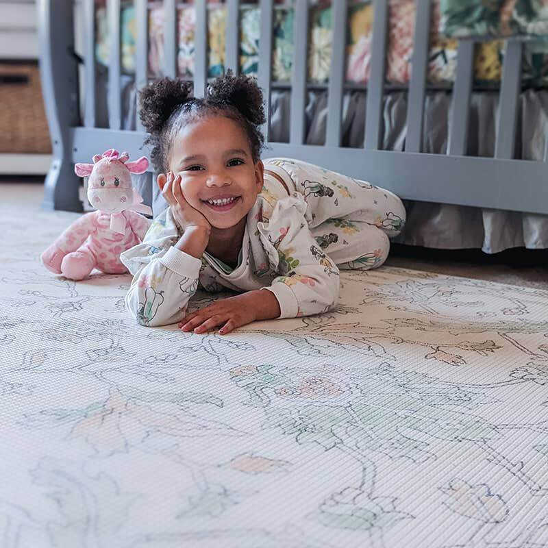 The Josephine Shwally Playmat - Double Sided with a girl smiling 
