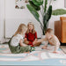The Josephine Shwally Playmat - Double Sided with kids playing 