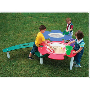 Tot Town Sand and water table with kids playing in the grass