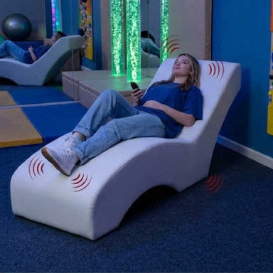 Vibroacoustic lounger in a sensory room front view