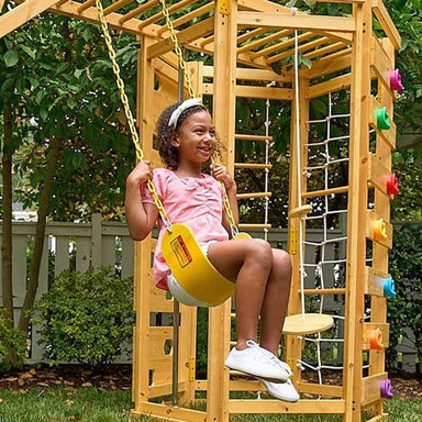wooden swing set with girl swinging