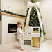 A Boy in Pajamas Poses Next to the Tiny Land Honey Kitchenett Playset