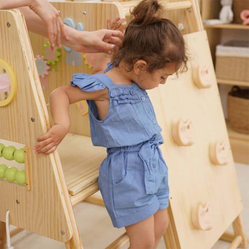 Child using Avenlur Cherry 5 in 1 indoor climber for active play