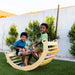 Toddler climbing on Avenlur Bailis Climbing Arch and Rocker for active indoor play