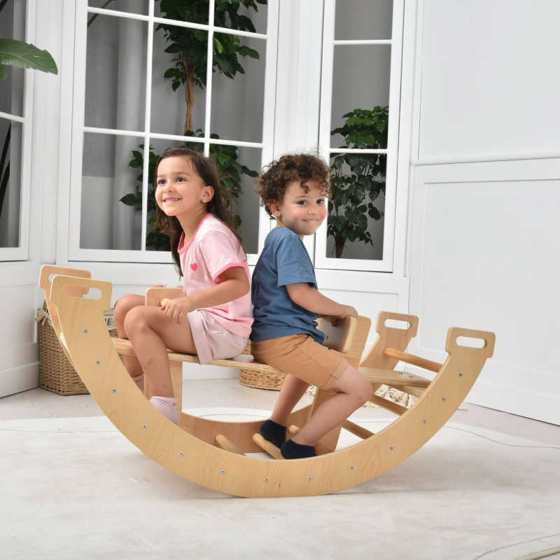Avenlur Bailis Climbing Arch and Rocker used as a rocking toy for sensory movement play
