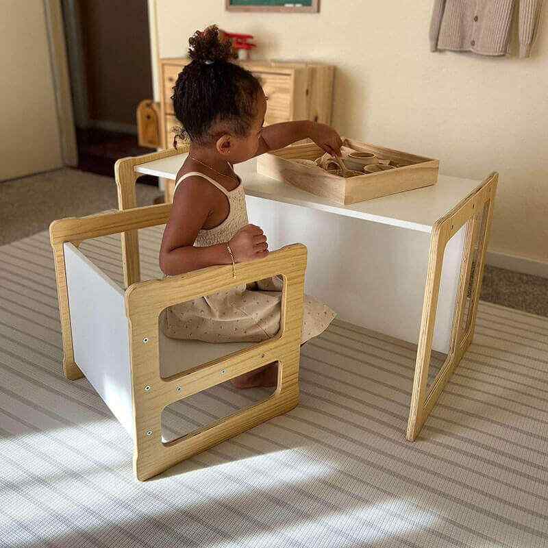 Child sitting at the Avenlur Hanover convertible toddler table set