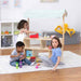 Avenlur Holly Wooden Market Stand – kids using the display shelves for pretend play