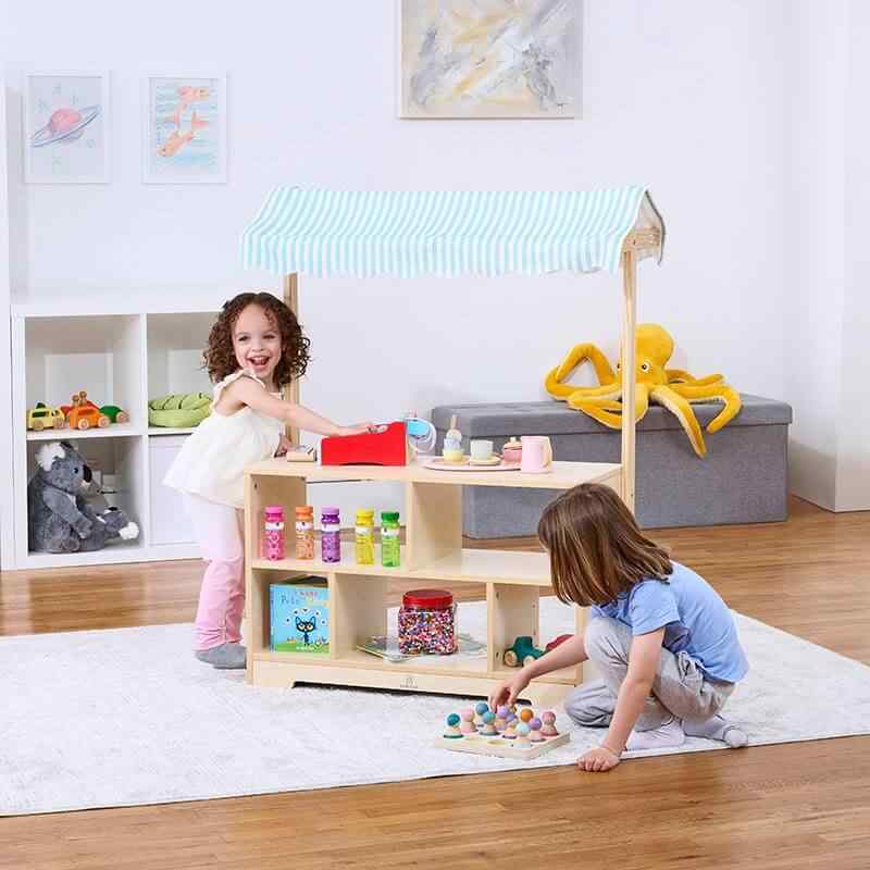 Avenlur Holly Wooden Market Stand – two kids playing shop together