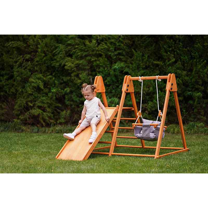 Avenlur Juniper Folding Indoor Outdoor Playset – child using the slide