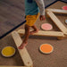 Majesty Balance Beam and Stepping Stones with a kid balancing on a zigzag