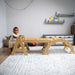 Maple Beginner Pikler Triangle and Rocker with a baby in a playroom