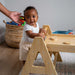 Maple Beginner Pikler Triangle and Rocker upclose with baby
