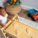 Maple Beginner Pikler Triangle and Rocker with a baby looking up