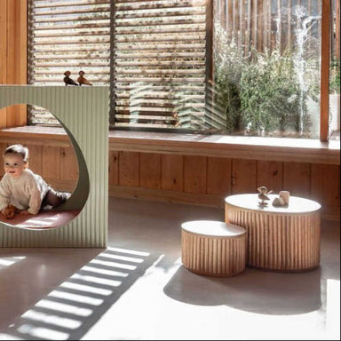 White Avenlur Nesting Fluted Tables arranged together for flexible playroom surfaces