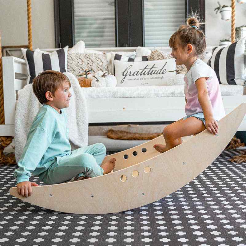 Kids playing in the Avenlur Rowan Rocking Boat