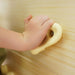 Close view of the rock climbing holds on the Avenlur Sweetgum XL indoor sensory playset