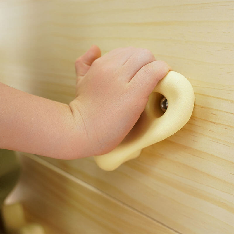 Close view of the rock climbing holds on the Avenlur Sweetgum XL indoor sensory playset