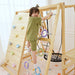 Full view of the Avenlur Sweetgum XL indoor sensory playset with slide, ladder, monkey bars, and swing