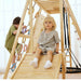 Close view of kids playing on the Avenlur Sweetgum XL indoor sensory playset