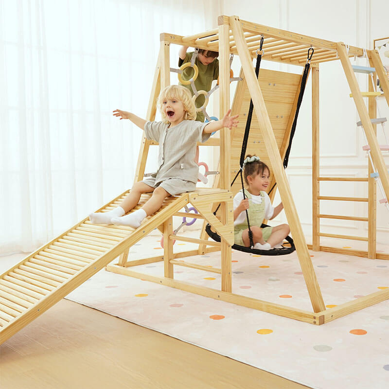 Three kids climbing, sliding, and swinging on the Avenlur Sweetgum XL indoor sensory playset