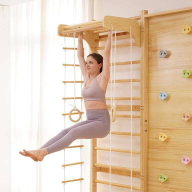Avenlur 9-in-1 Modular Wall Gym for Children a Woman Doing Swing on a Pull Up Bar