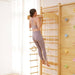 Avenlur Walnut 9-in-1 Kids Climbing Gym a Woman Doing Pull Ups