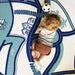 Baby playing on the illustrated reverse side of the Dakota Blue Shwally Playmat