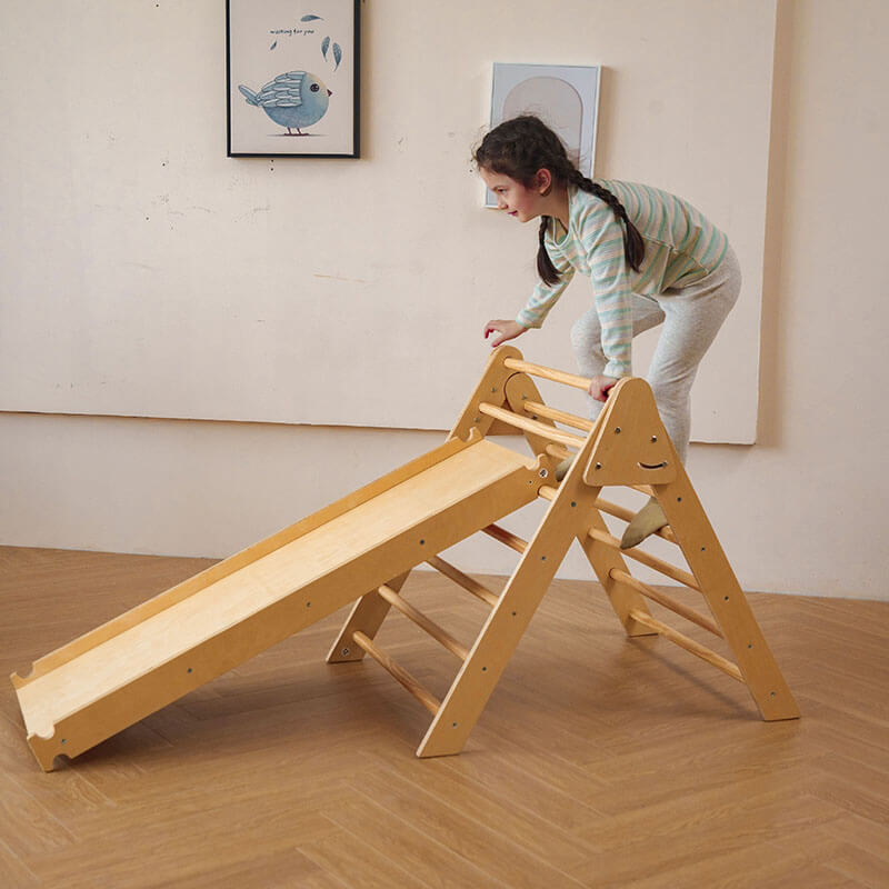 bazel_pikler_6_in_1_climber_with_rocker_arch_and_slide_set_girl_sliding