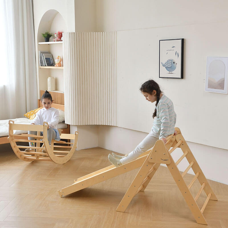 bazel_pikler_6_in_1_climber_with_rocker_arch_and_slide_set_girls_playing