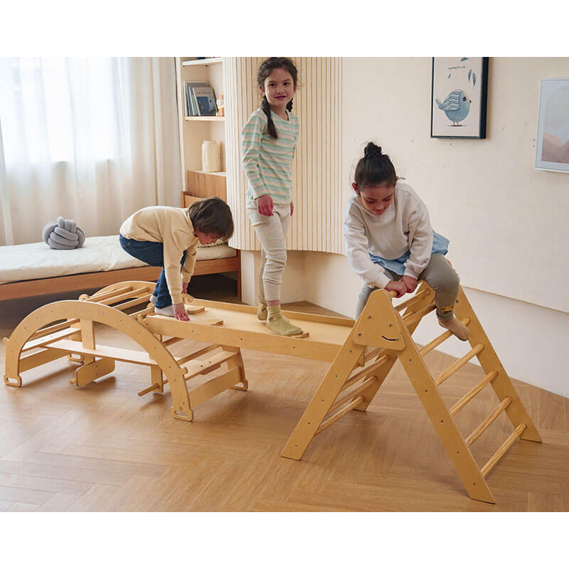 bazel_pikler_6_in_1_climber_with_rocker_arch_and_slide_set_kids_playing_bridge
