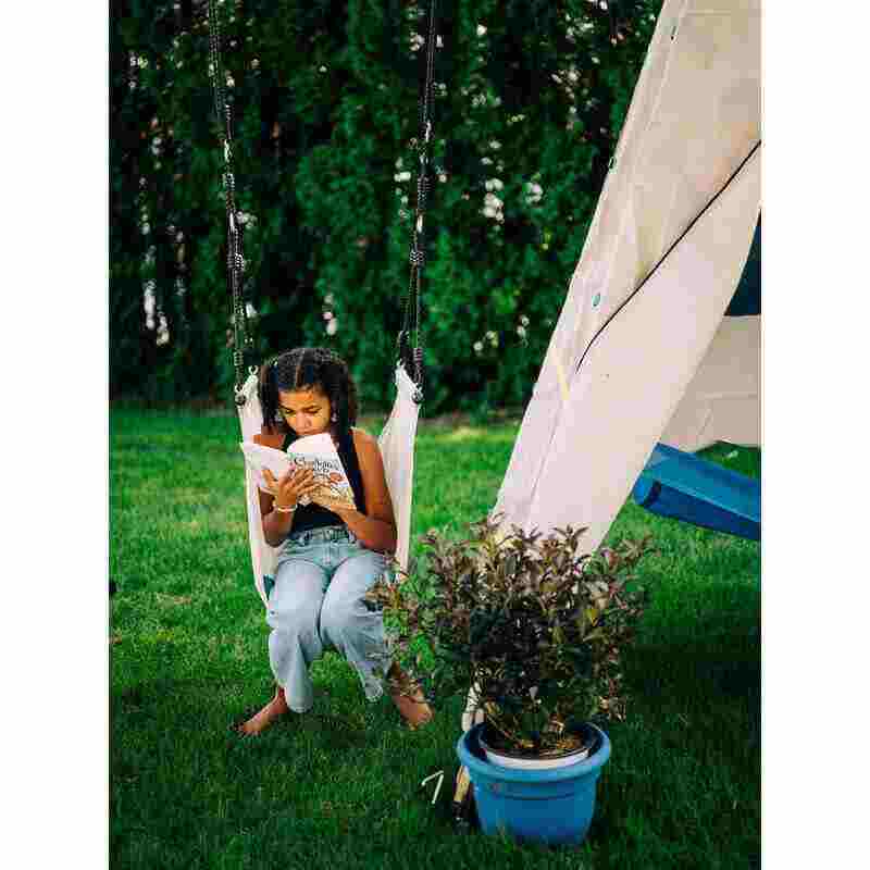 Bijou Big Bijou – child reading inside outdoor play structure