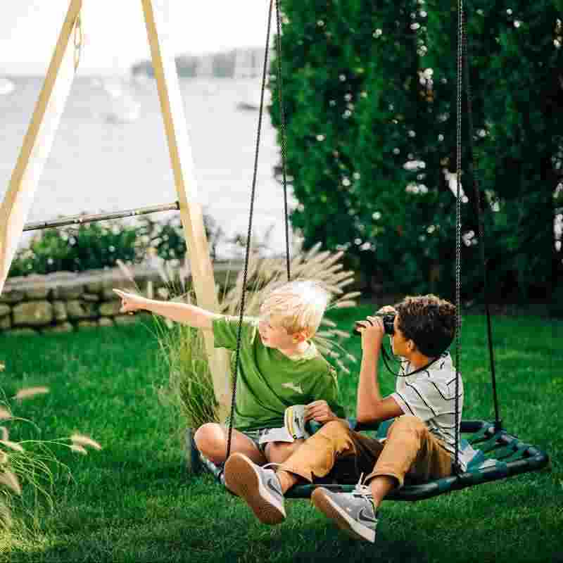 Bijou Kubix Swing with two kids seated on the hexagon platform
