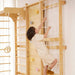 Boy Ascends a Climbing Wall on the Avenlur 9-in-1 Swedish Ladder Gym