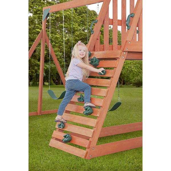 cedar_chalet_wooden_swing_set_rock_wall_girl_climbing