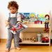 Child Holding a Book in a Room With Kidodido Kids Room Wooden Bookshelf
