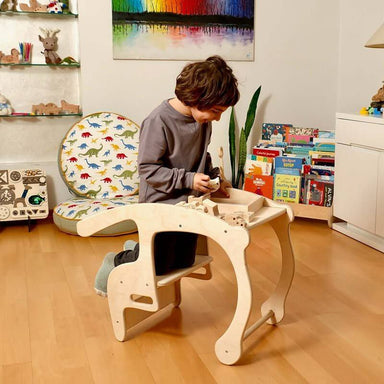 Child Kneling on Kidodido Child Sized Rocking Chair and Activity Table
