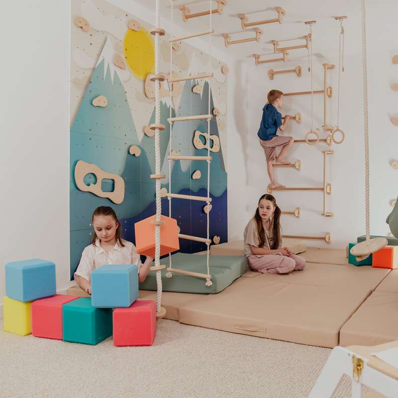 Children's Home Gym – kids playing beside Alaska wall with optional foam cubes