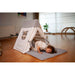climbing triangle with boy on a mat