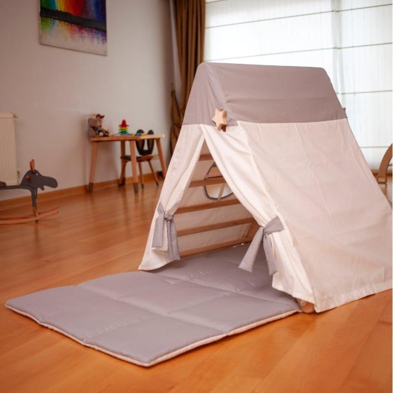 climbing triangle with tan cover and mat