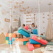 Wood and Hearts Climbing Wall Playground – kids playing with optional foam blocks beside the wall gym