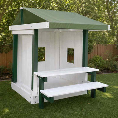 White and Green Congo Playhouse in a backyard