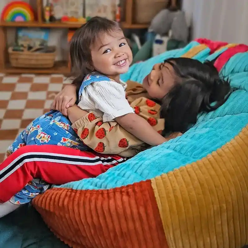 CordaRoy's Bambino Kids Chair – child lounging in Bambino chair
