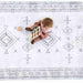 Baby lying on the cushioned Dakota Ivory Shwally Playmat viewed from above