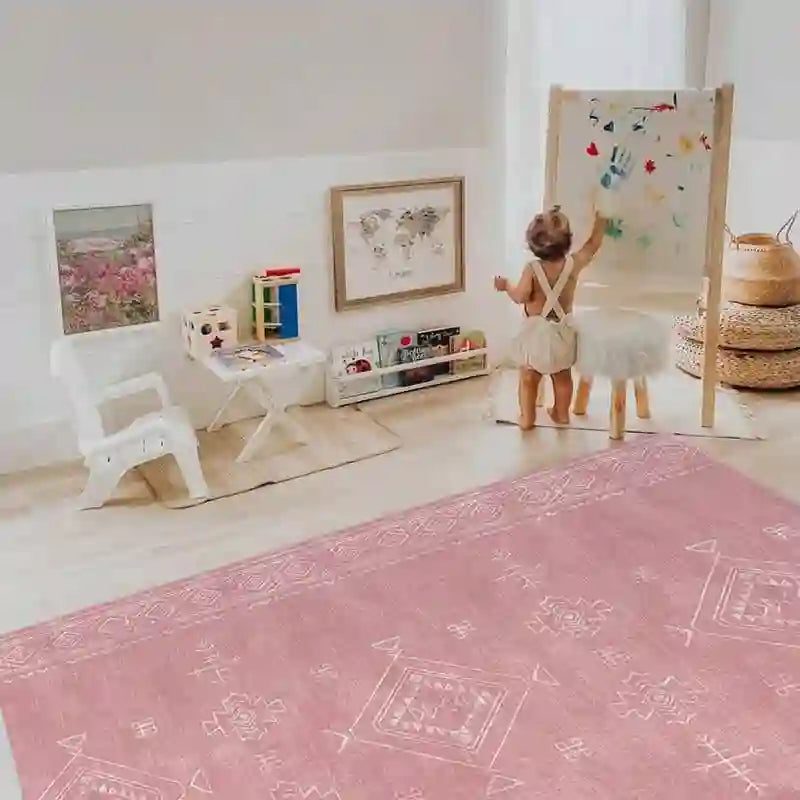 Baby enjoying creative play beside the Dakota Rose Shwally Playmat