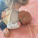 Siblings sharing a quiet moment on the Dakota Rose Shwally Playmat
