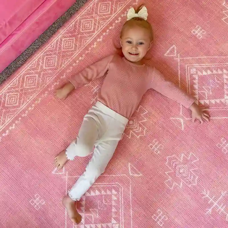 Top view of a girl relaxing on the Dakota Rose Shwally Playmat