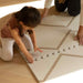 
Eeveve beni autumn gold double sided playmat with a boy playing 