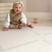 Eeveve Beni Cashmere Double Sided Play Mat with a baby