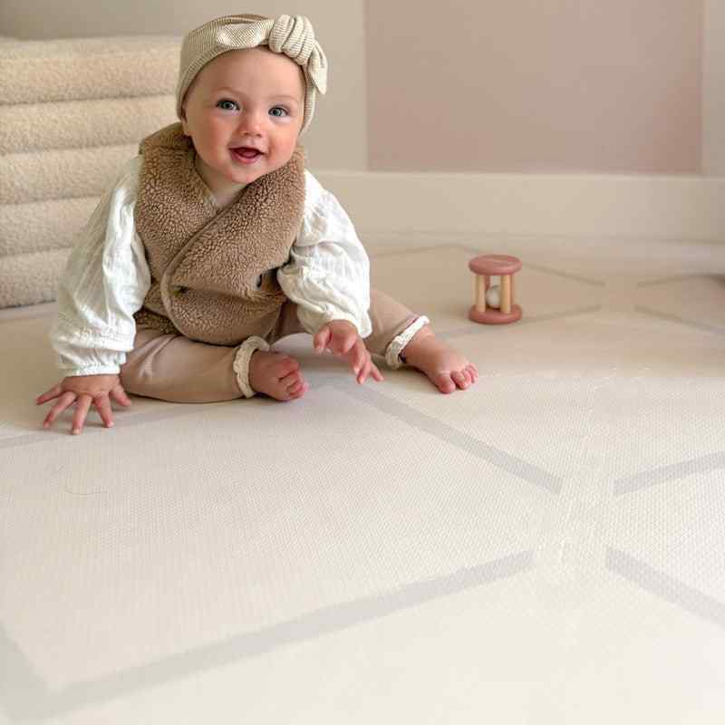Eeveve Beni Cashmere Double Sided Play Mat with a baby