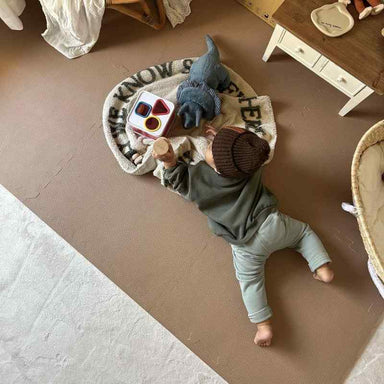 Eeveve Cinnamon Double Sided Play Mat with a baby playing 
